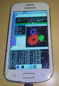 Samsung Galaxy Trend Lite (samsung-kylevess) running htop, glxgears and thunar with the XFCE4 interface