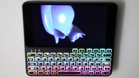 Pocket P.C. running glmark2-egl-drm with rainbow backlit keyboard.